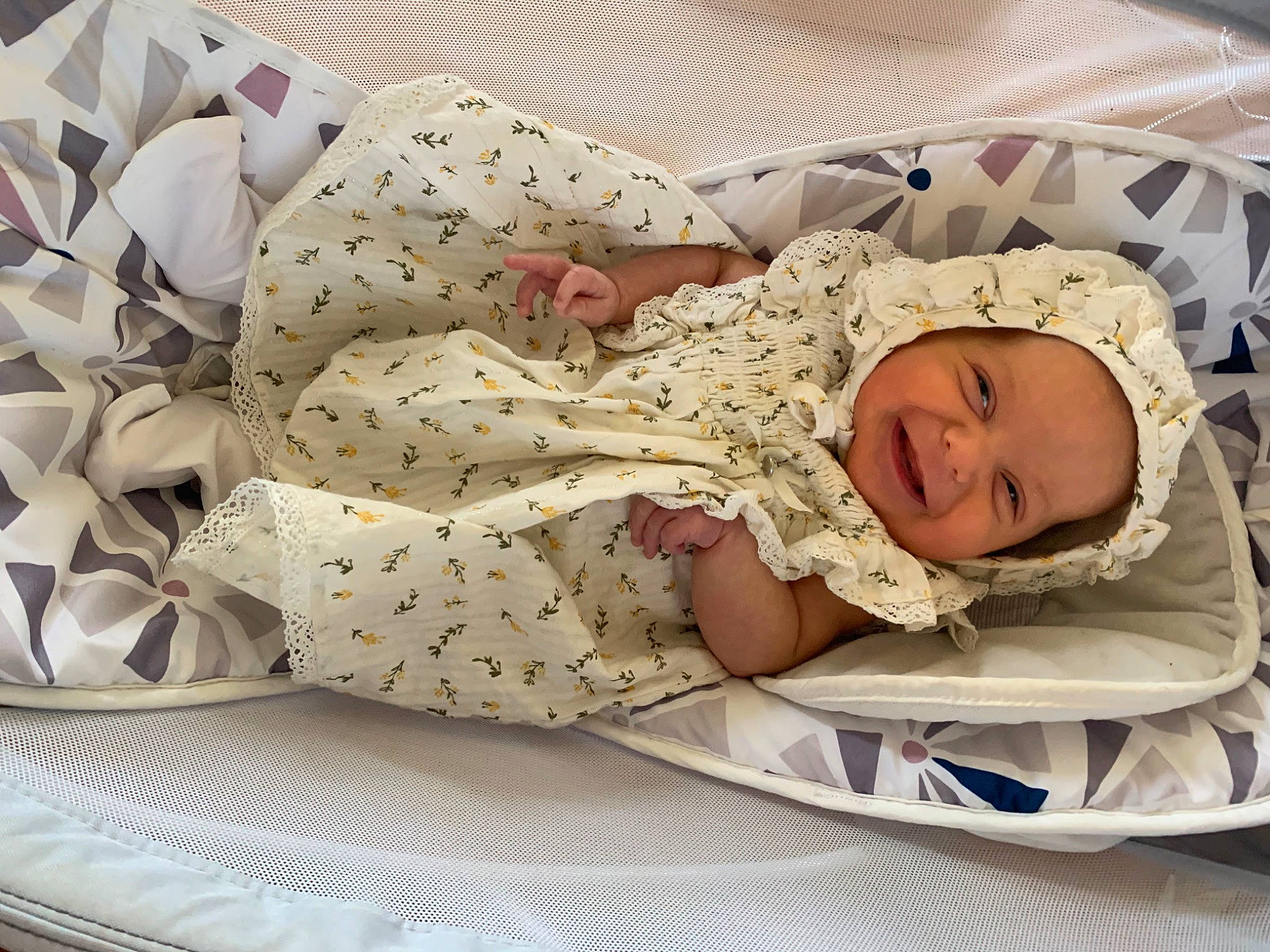 Evelyn is registered to the contest to win money with this photo: arm, baby, baby_products, baby_safety, baby_sleeping, baby_toddler_clothing, bedding, bedtime, child, comfort, hand, headwear, human_body, linens, nap, pattern, person, room, skin, sleeve