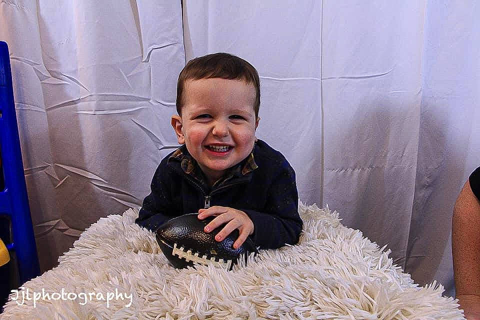 Sullivan joined the competition — help win amazing prizes! baby_toddler_clothing, child, comfort, comfort_food, flooring, fun, fur, grass, happy, joy, laugh, person, play, portrait_photography, room, sitting, smile, toddler, vegetable, wood