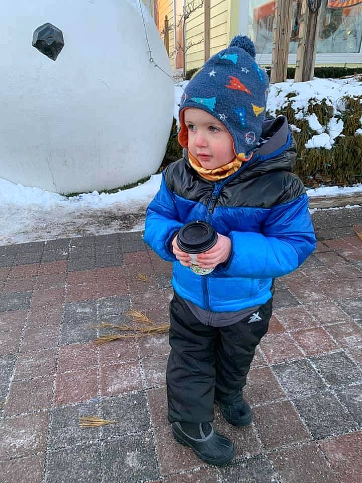 Sullivan joined the competition — help win amazing prizes! cap, child, electric_blue, face, freezing, fun, glove, happy, headwear, hood, hoodie, jacket, leisure, person, personal_protective_equipment, plant, playing_in_the_snow, recreation, snow, toddler