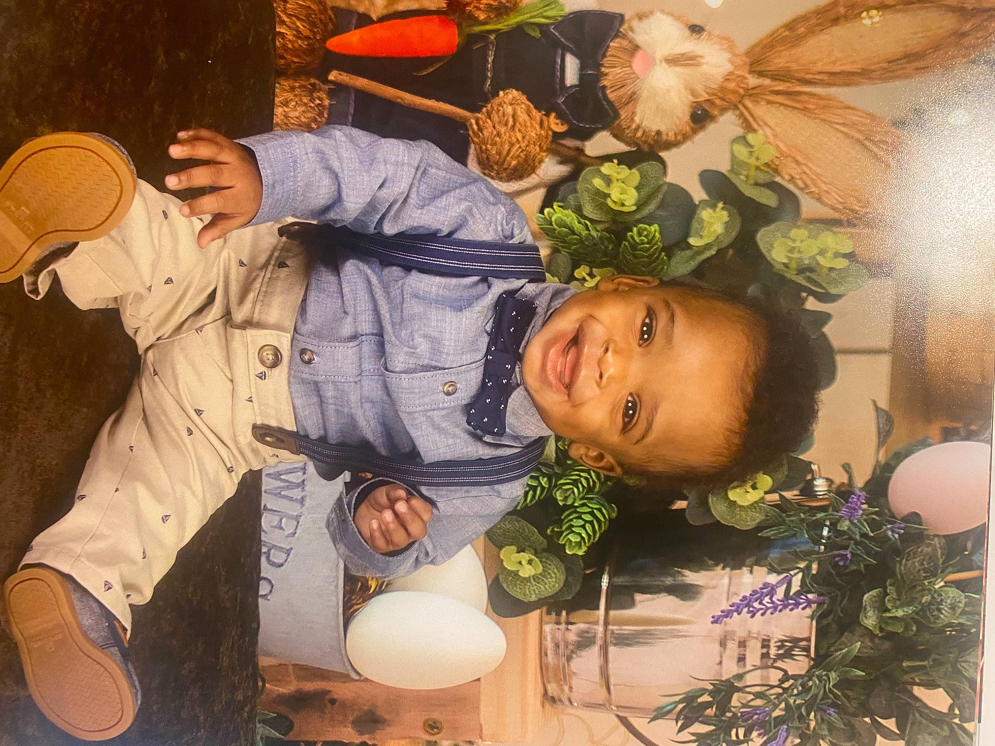 Tahj is registered to the contest to win money with this photo: art, baby, child, cut_flowers, event, floral_design, flower_arranging, fun, grass, happy, hat, illustration, joy, mechanical_fan, organism, person, plant, smile, sun_hat, toddler