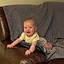 Vira is registered to the contest to win money with this photo: baby, smiling, couch, leather, pillow, blanket, indoors, child, happy, infant, person, cute, relaxed, home, furniture, young_child, sitting, cozy, portrait, skin