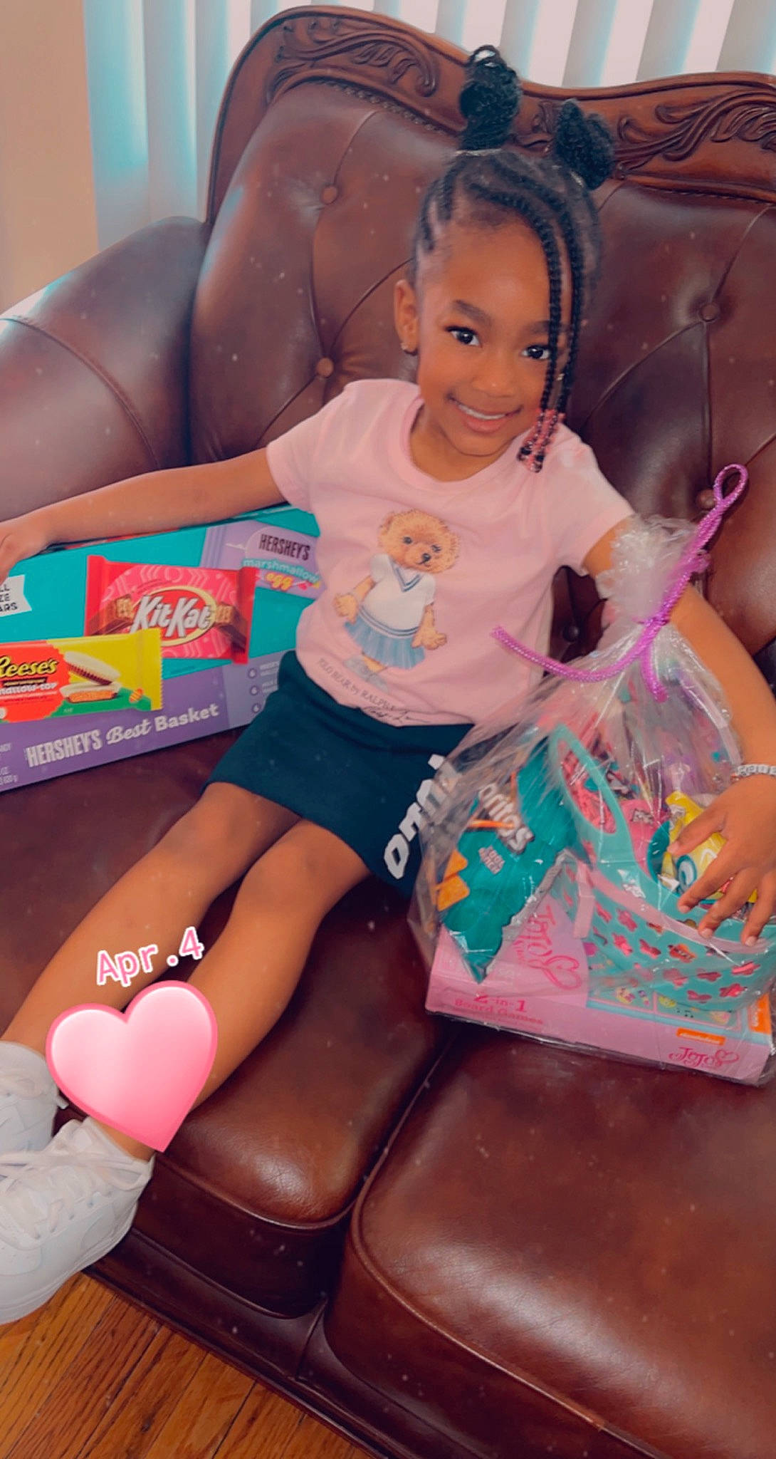 Addisyn is registered to the contest to win money with this photo: baby_toddler_clothing, bag, child, comfort, face, fun, hairstyle, happy, human_leg, joy, knee, lap, leisure, magenta, person, pink, shorts, sitting, smile, sock