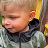 Owen participe au concours pour gagner de l'argent avec cette photo : child, blond_hair, curious, jacket, camo, playground, outdoor, young, face, person, smile, side_profile, hoodie, yellow, wood, hand, casual, cute, kid, nature