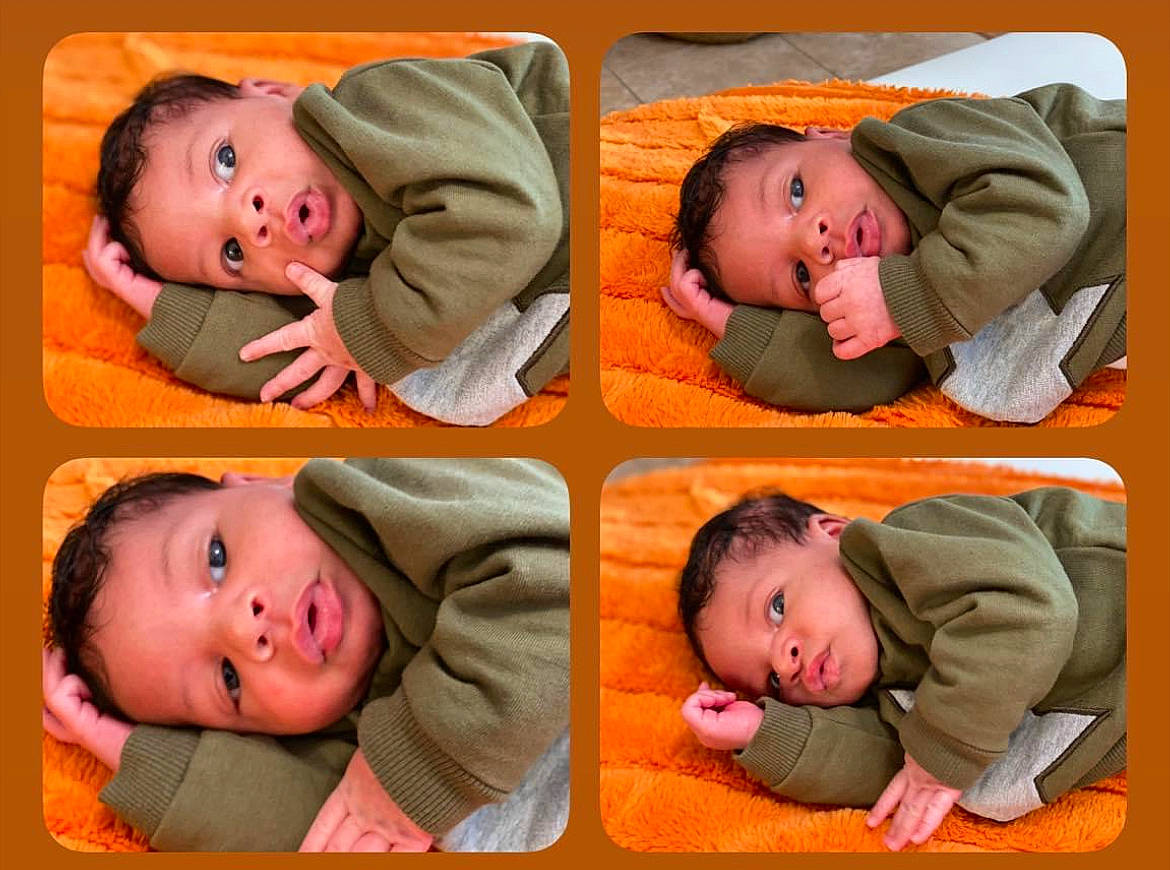 Amir is registered to the contest to win money with this photo: baby, baby_toddler_clothing, cheek, child, chin, comfort, face, facial_expression, green, head, human, mouth, orange, organ, person, photograph, product, skin, sleeve, smile