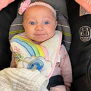 Lynzee joined the competition — help win amazing prizes! baby, infant, car_seat, headband, flower, bib, pacifier, blanket, drool, pink_clothing, child, cute, portrait, indoors, seatbelt, happy, face, blue_eyes, soft_lighting, cozy