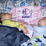 Jameson is registered to the contest to win money with this photo: baby, sleeping, blanket, hand_holding, cute, infant, child, sleep, pajamas, bed, soft, peaceful, toddler, cozy, nap, indoors, rest, comfort, two_children, face