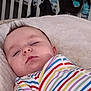 Jameson joined the competition — help win amazing prizes! baby, sleeping, crib, blanket, striped_clothing, infant, peaceful, face, head, resting, child, nursery, soft_texture, person, indoors, closeup, cozy, young, cute, calm
