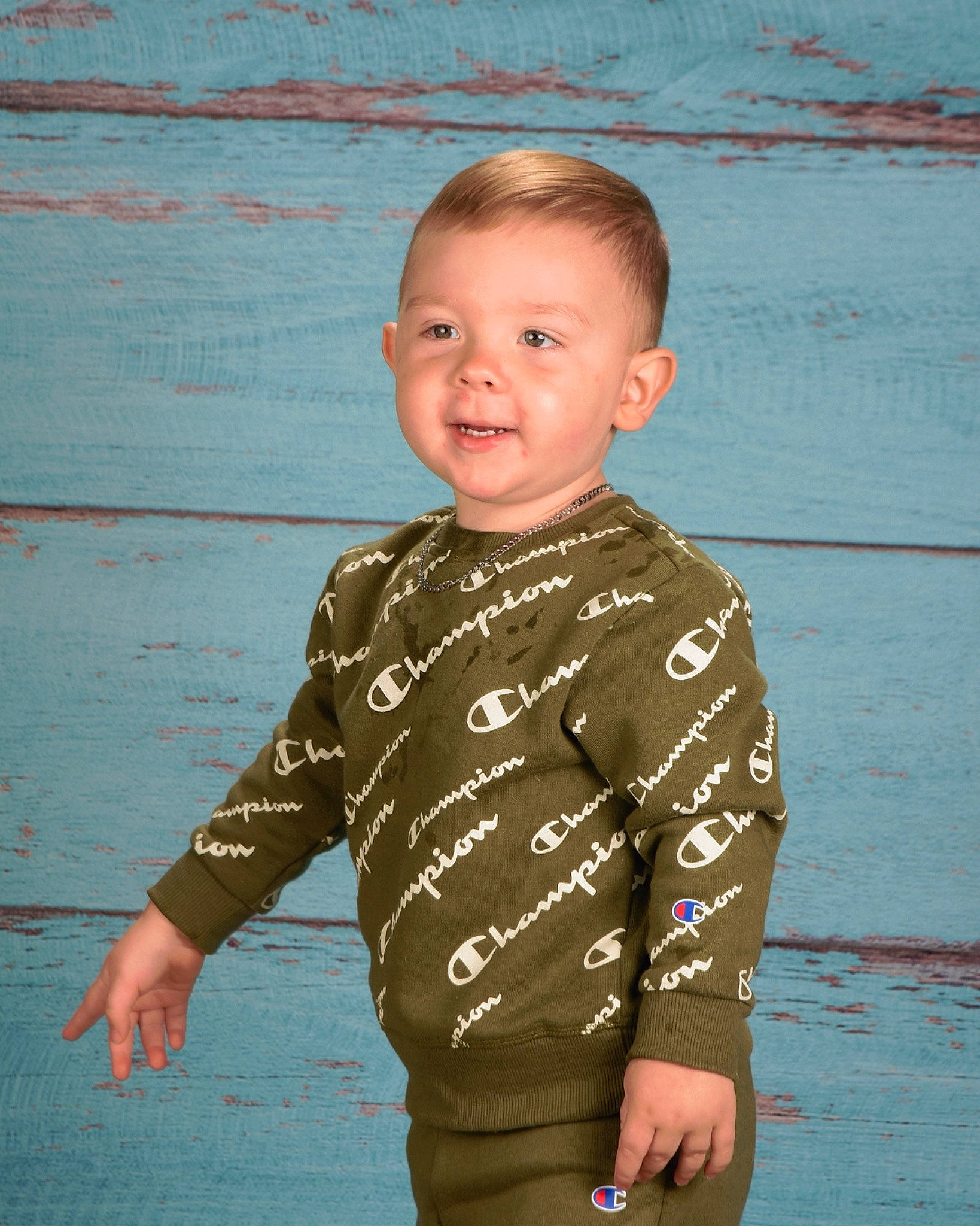 Kaison is registered to the contest to win money with this photo: beach, body_of_water, child, cool, face, fun, gesture, happy, head, human_body, jeans, leisure, neck, people_in_nature, person, sleeve, smile, t_shirt, toddler, trunk