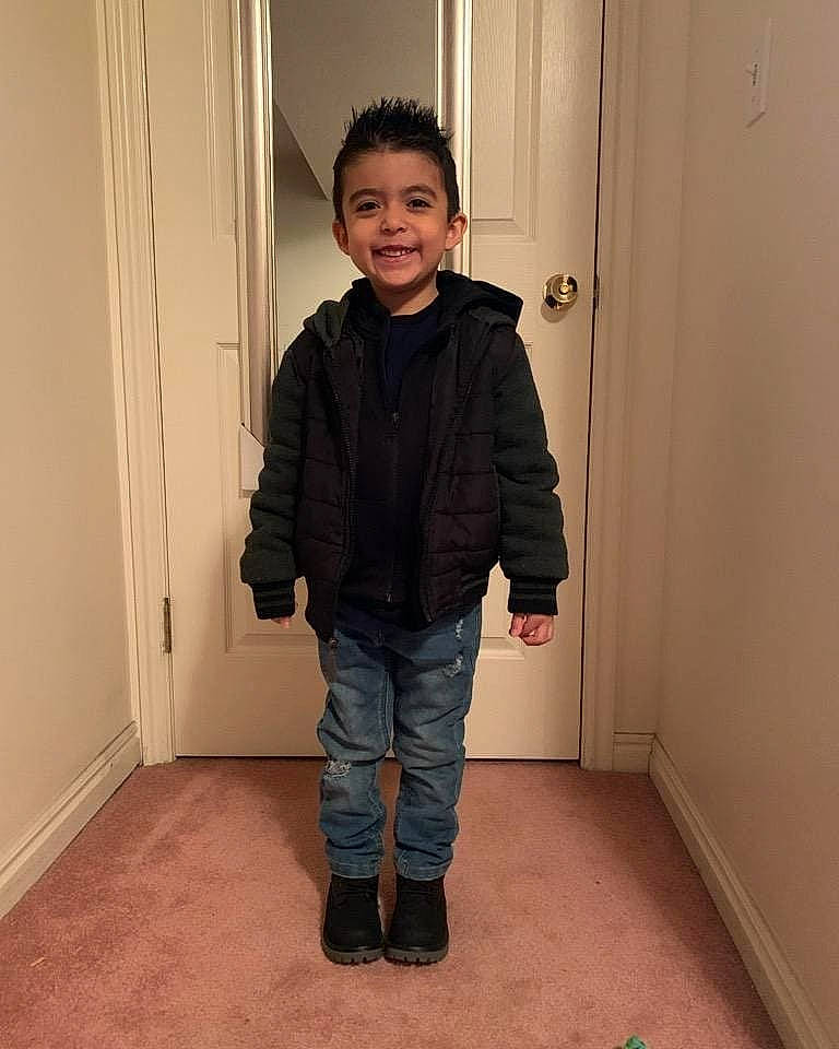 Carlos Daniel is registered to the contest to win money with this photo: child, floor, flooring, jacket, jeans, joy, outerwear, person, shoe, shoulder, standing, trousers