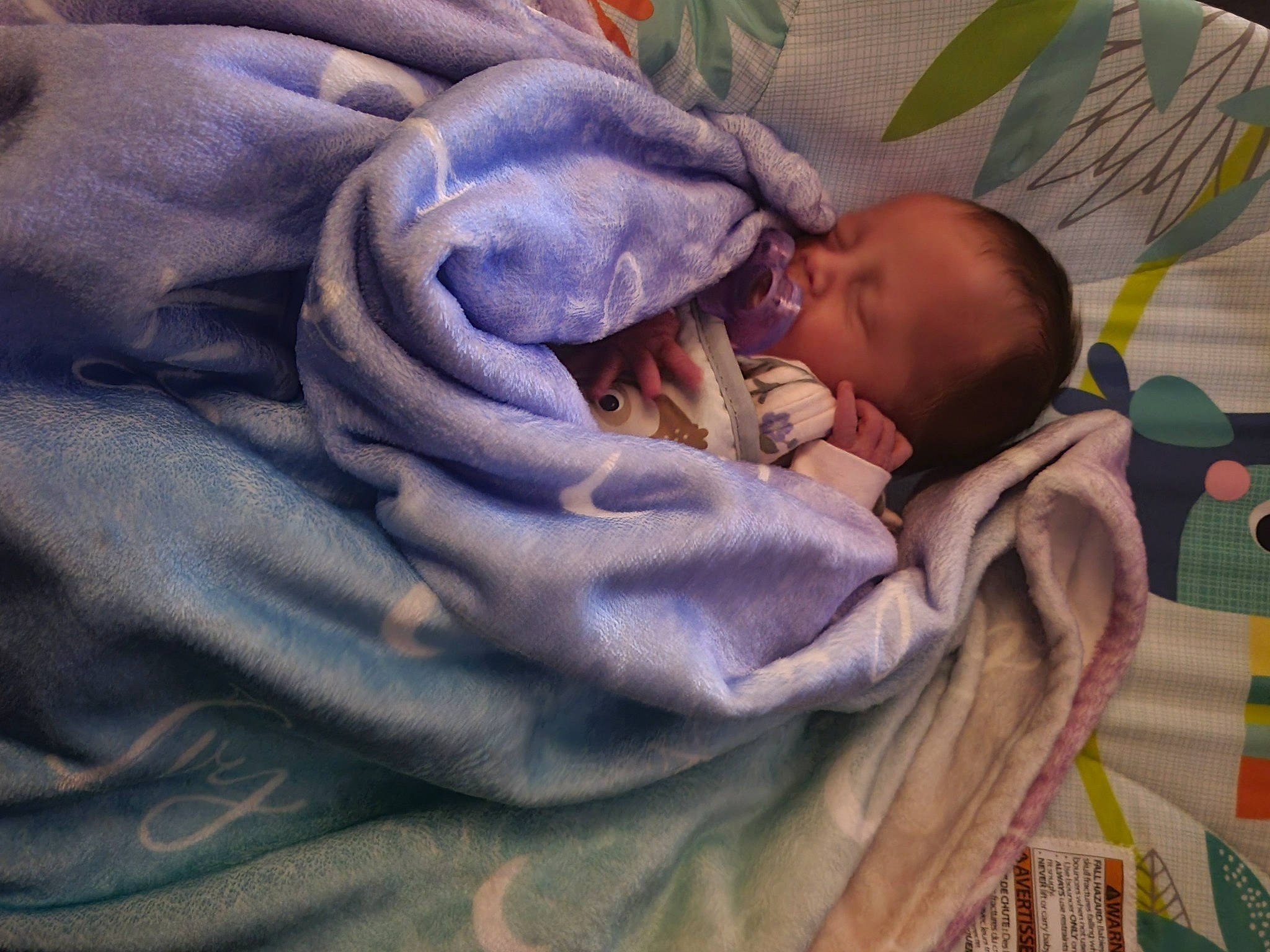 Ivy joined the competition — help win amazing prizes! art, baby, baby_products, baby_sleeping, baby_toddler_clothing, bed_sheet, bedding, bedtime, blanket, cheek, child, comfort, electric_blue, linens, nap, pattern, person, purple, textile, toddler