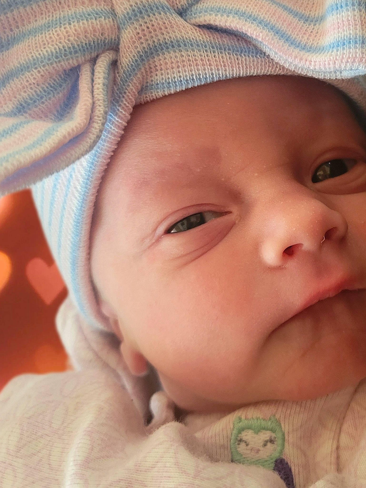 Ivy is registered to the contest to win money with this photo: baby, cap, cheek, chin, cool, eye, eyebrow, eyelash, face, finger, forehead, happy, headwear, iris, lip, mouth, nose, person, pink, skin