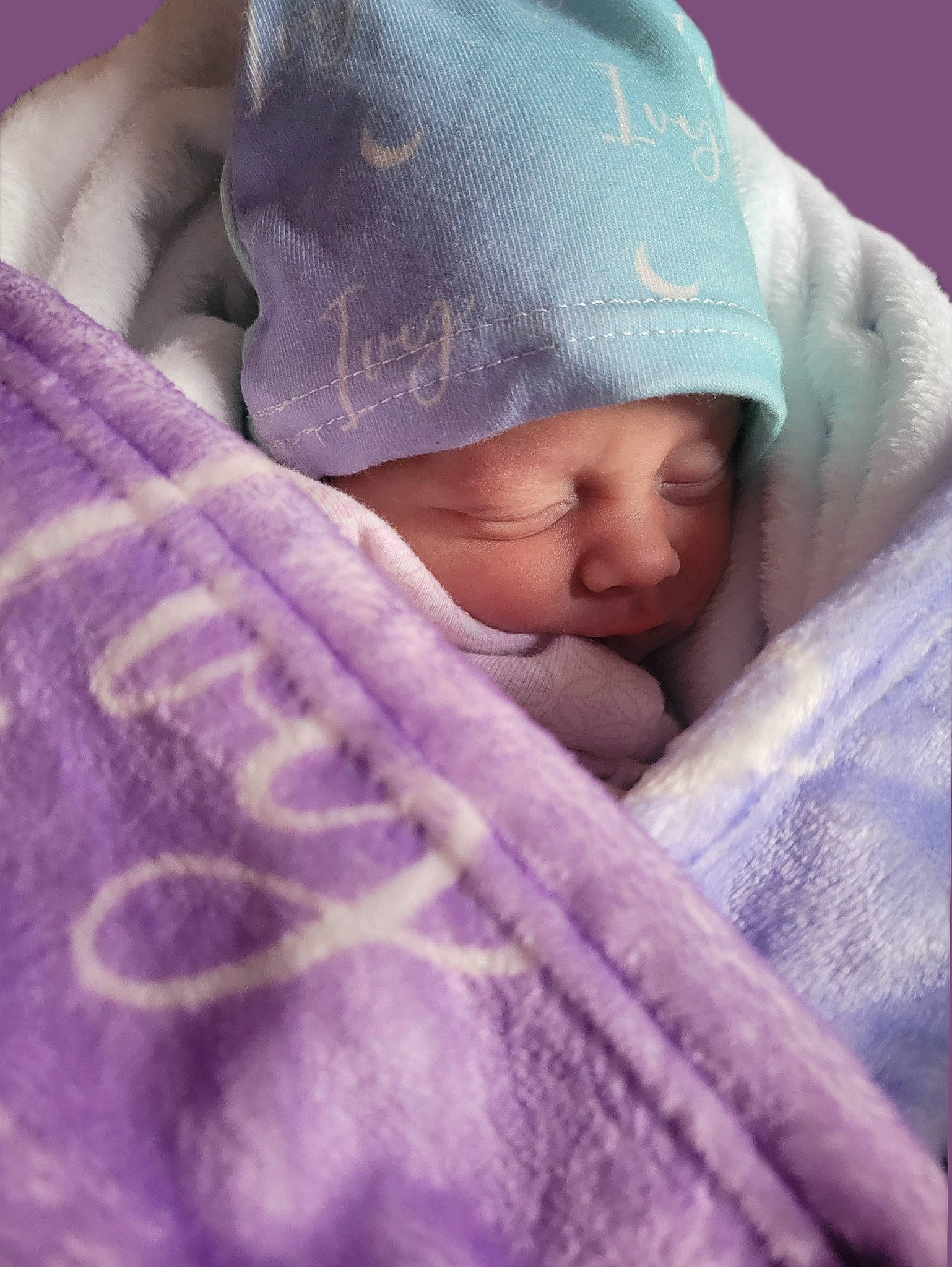 Ivy is registered to the contest to win money with this photo: baby, baby_sleeping, baby_toddler_clothing, cap, cheek, child, chin, comfort, eye, hat, headgear, headwear, knit_cap, linens, magenta, nap, person, purple, thumb, toddler