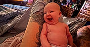 Ariyah is registered to the contest to win money with this photo: baby, diaper, tattoo, leg, bedroom, bed, blanket, smile, laughing, person, furniture, dresser, clothing, mirror, television, indoor, happy, skin, adult, relaxation