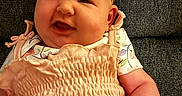 Ariyah joined the competition — help win amazing prizes! baby, bow, child, clothing, couch, cute, dress, fabric, face, happy, headband, indoor, infant, peach, person, pink, portrait, sitting, skin, smiling