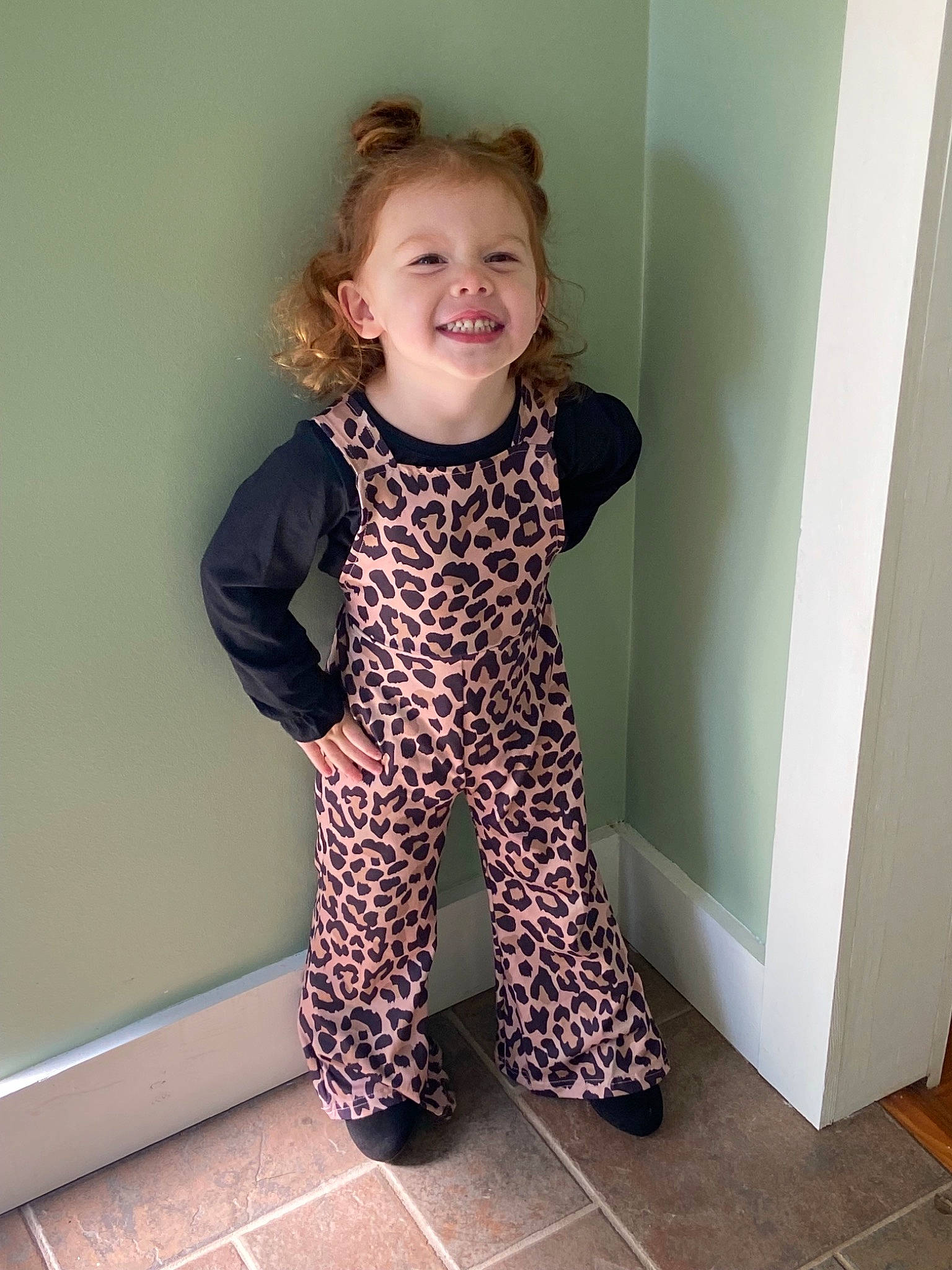 Everly Rose is registered to the contest to win money with this photo: active_pants, arm, baby_toddler_clothing, floor, flooring, hair, head, human_body, joy, knee, leg, neck, outerwear, pattern, person, shoulder, sleeve, smile, t_shirt, thigh