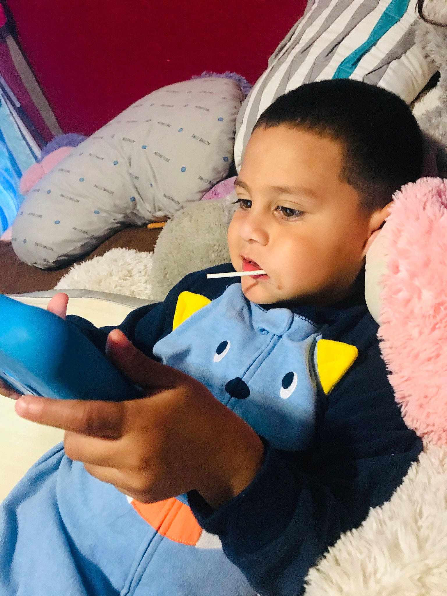 Lionel is registered to the contest to win money with this photo: baby, baby_products, child, ear, electronic_device, nose, person, play, skin, stuffed_toy, toddler