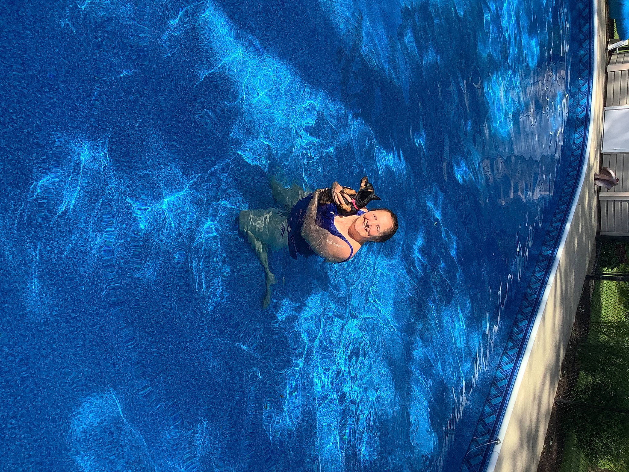 Ebony is registered to the contest to win money with this photo: aqua, azure, body_of_water, electric_blue, fun, grass, leisure, leisure_centre, personal_protective_equipment, recreation, reflection, shorts, swimmer, swimming_pool, underwater, vacation, water, water_park, wave, world