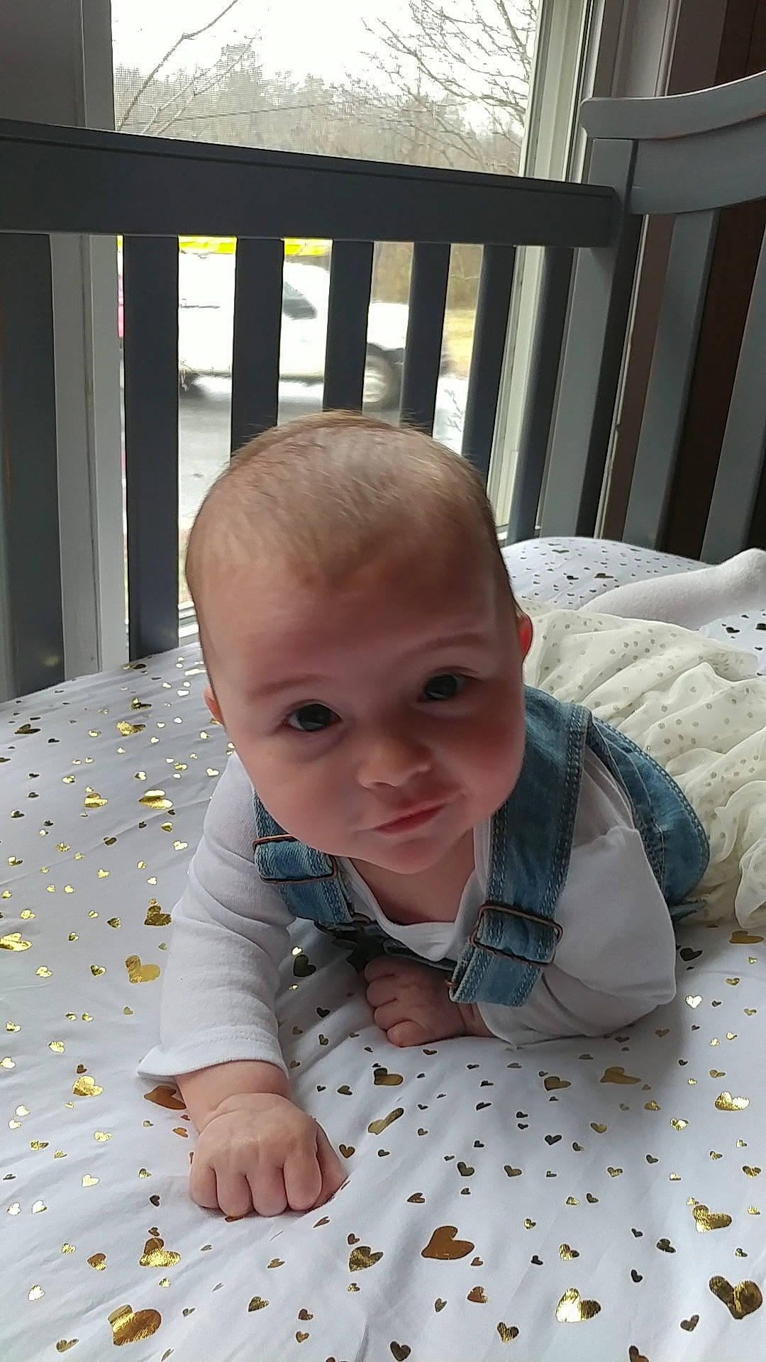 Carley is registered to the contest to win money with this photo: baby, cheek, child, crawling, eye, face, head, person, room, sitting, skin, toddler, tummy_time