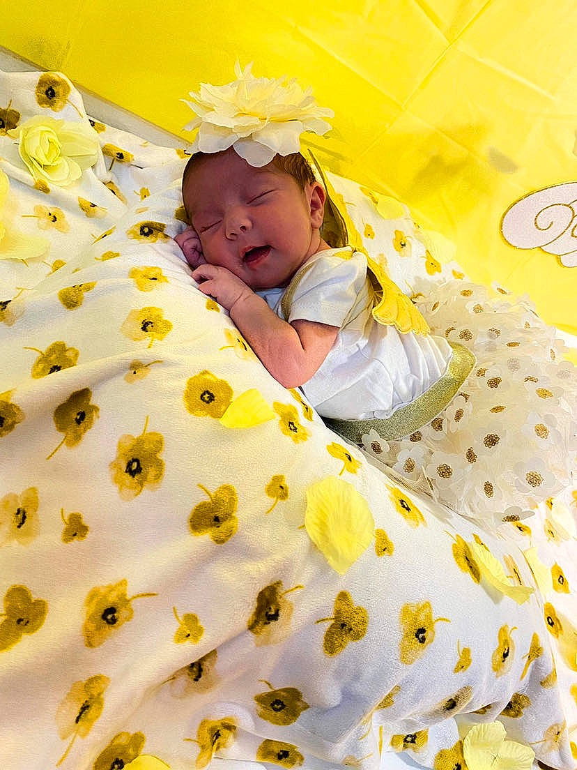 Nevaeh is registered to the contest to win money with this photo: baby, baby_products, baby_safety, baby_sleeping, baby_toddler_clothing, bed, bed_sheet, bedding, bedtime, child, comfort, event, happy, linens, nap, pattern, person, room, sleep, toddler