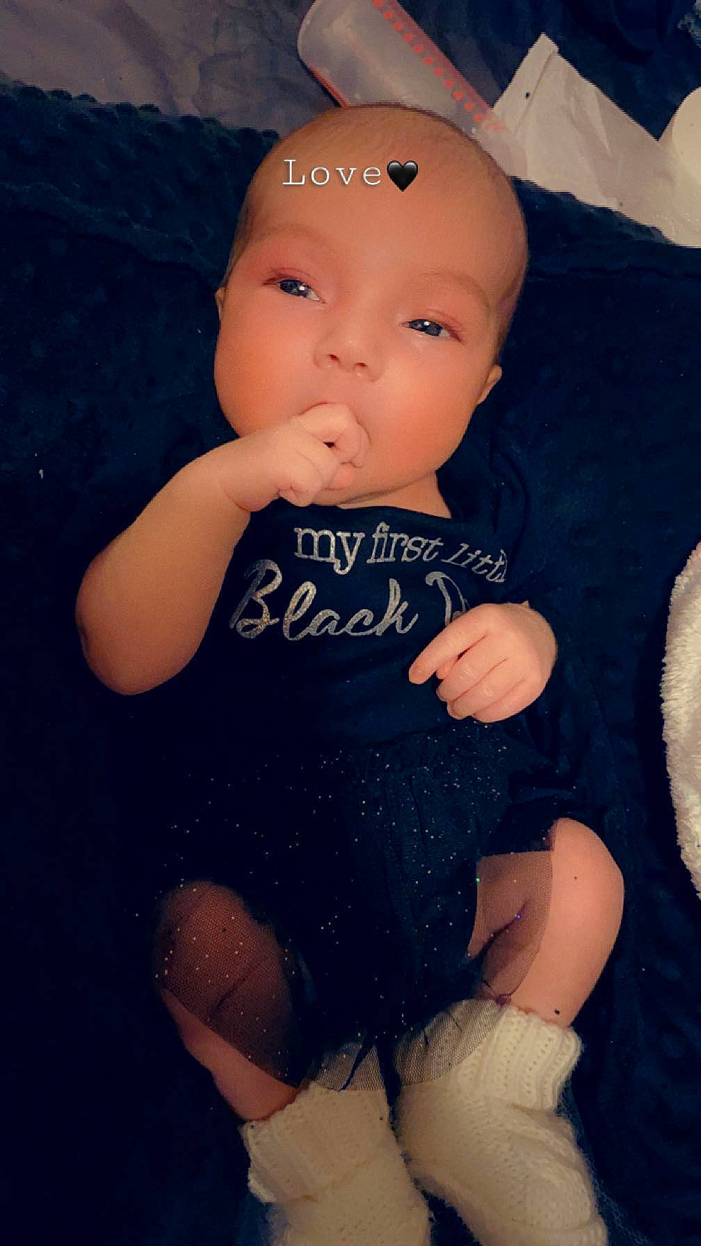 Nevaeh is registered to the contest to win money with this photo: baby, baby_toddler_clothing, cheek, child, eye, finger, flash_photography, happy, human_body, human_leg, iris, leg, lip, nail, neck, person, skin, sleeve, thigh, toddler