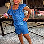 Alaiya joined the competition — help win amazing prizes! child, girl, denim, romper, barefoot, smiling, earrings, necklace, carpet, living_room, coffee_table, beauty_products, fireplace, furniture, glass_table, home_interior, curtains, toy, happy, posing