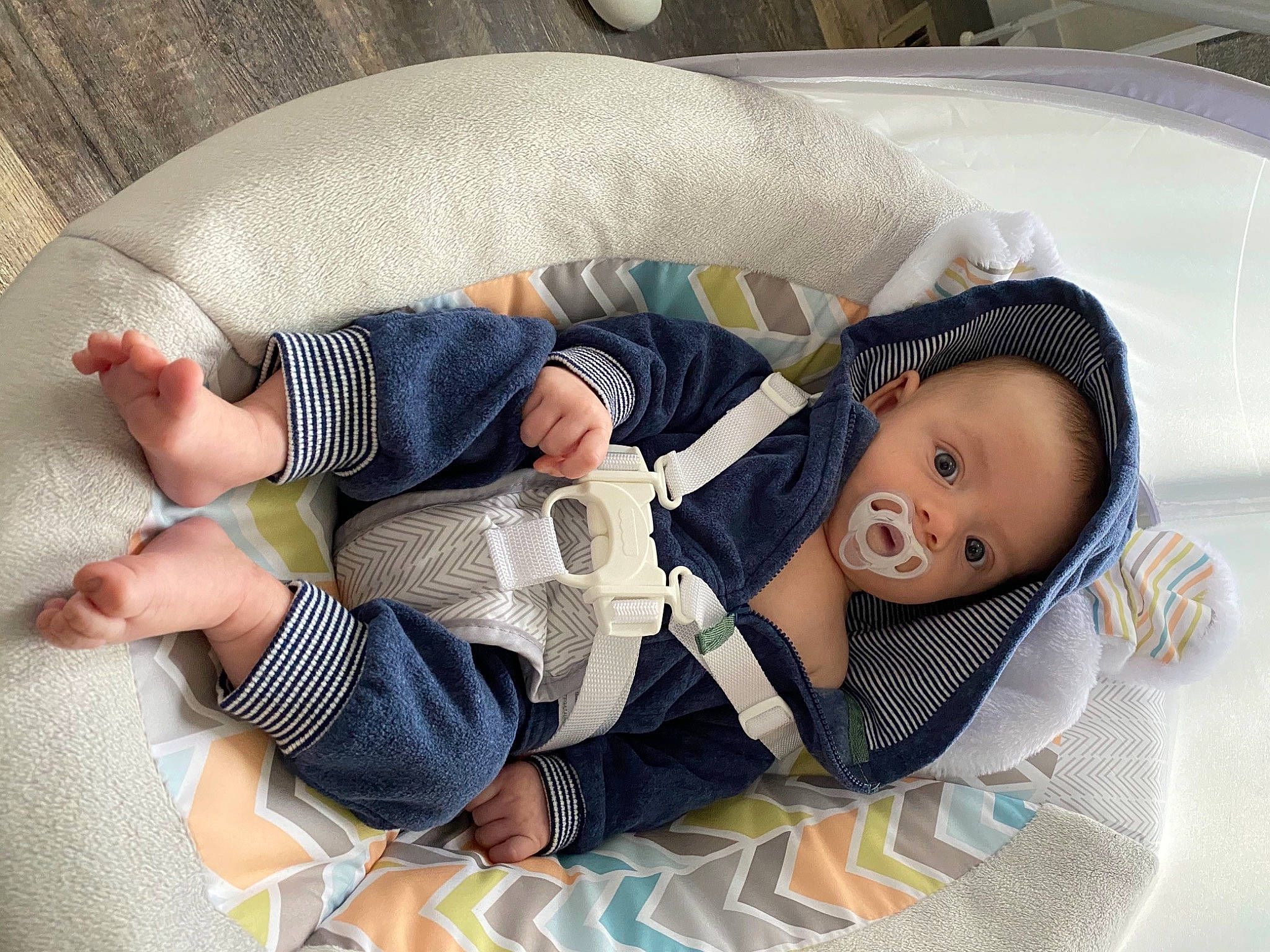 Karson is registered to the contest to win money with this photo: baby, baby_carriage, baby_products, baby_safety, baby_sleeping, baby_toddler_clothing, child, comfort, doll, eye, human_body, infant_bed, lap, linens, nap, pattern, person, sitting, skin, sock