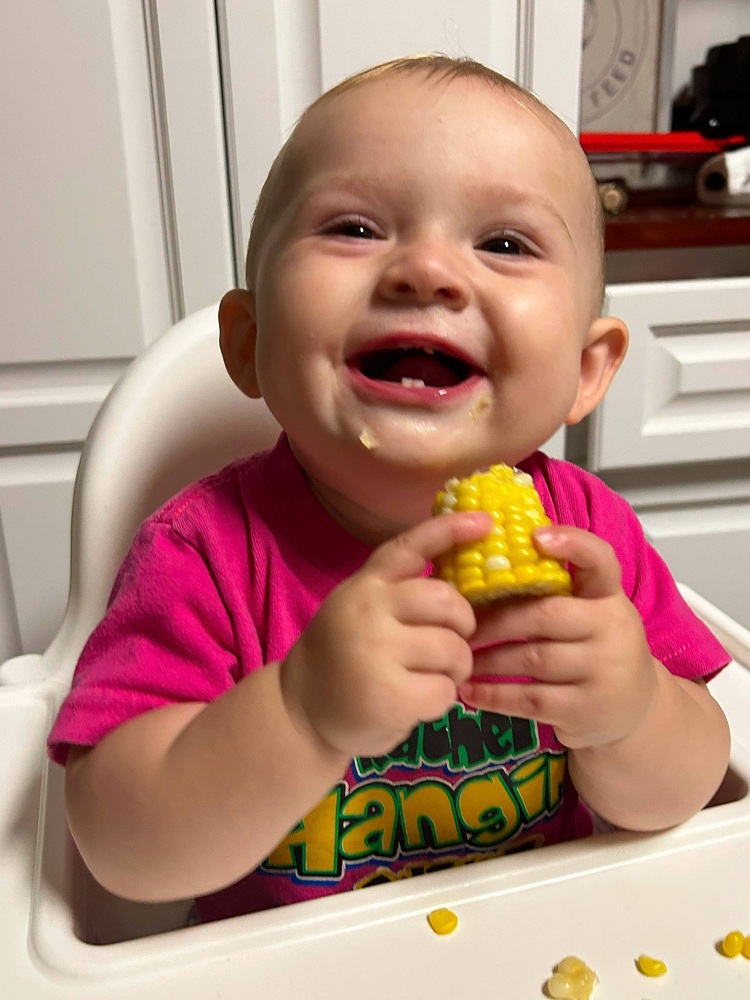 Lainey is registered to the contest to win money with this photo: baby, baby_laughing, biting, child, cuisine, finger, food, food_craving, fun, happy, joy, mouth, nose, person, play, sharing, smile, sweet_corn, sweetness, tableware