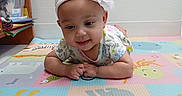 Emerald joined the competition — help win amazing prizes! animal_pattern, baby, books, child, colorful, curious, cute, floor, flower, headband, home, indoor, infant, koala, lion, papers, play_mat, smiling, toddler, wooden_shelf