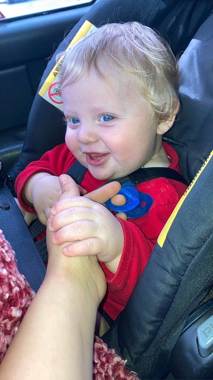 Brantlee is registered to the contest to win money with this photo: arm, baby, cheek, chin, eye, face, facial_expression, finger, fun, gesture, hand, happy, human, iris, lip, organ, person, product, skin, smile