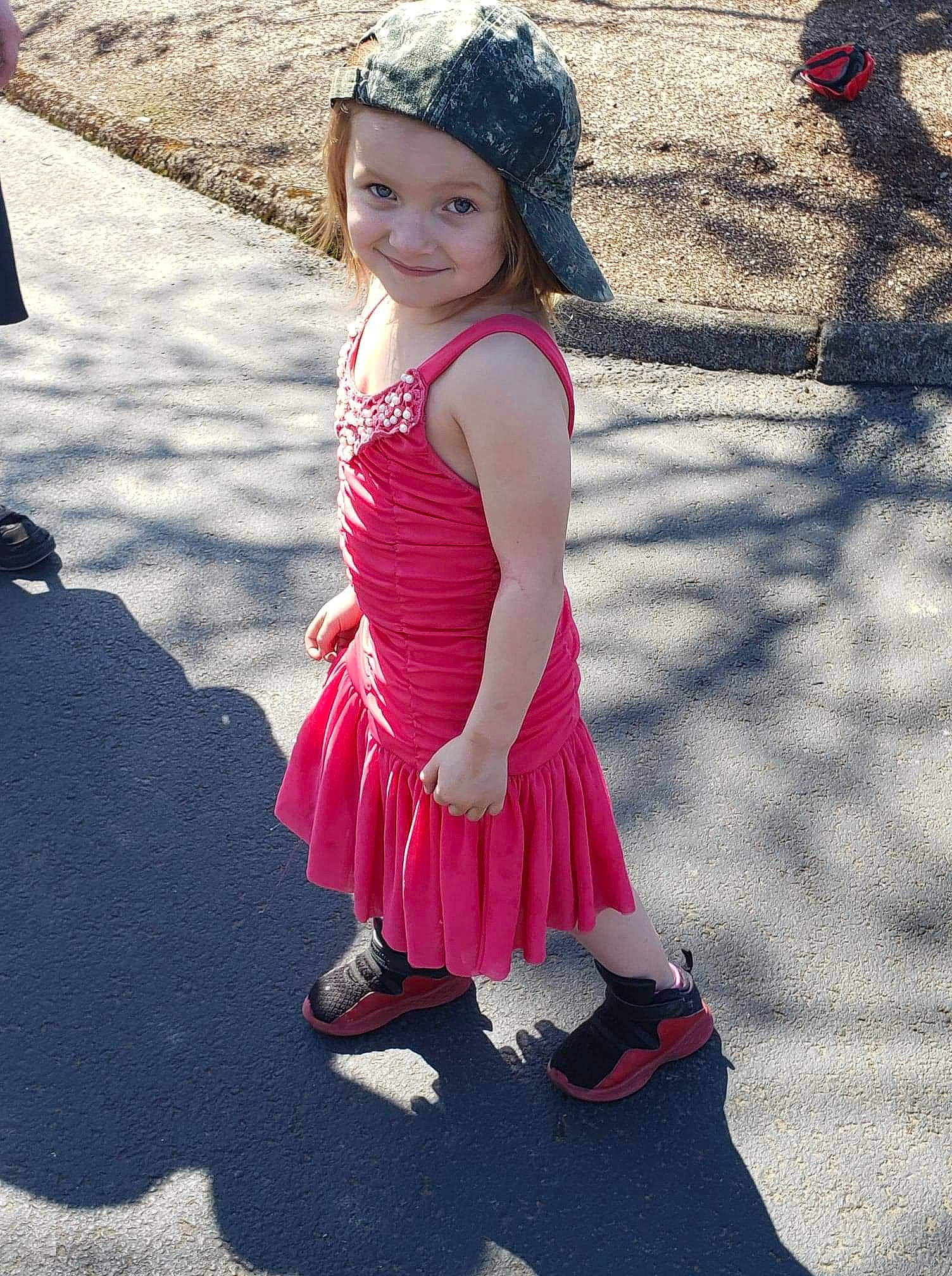 Leslie is registered to the contest to win money with this photo: beauty, child, clothing, costume, dress, fashion, footwear, headwear, joy, magenta, people, person, photography, pink, plant, red, shoe, smile, style, textile