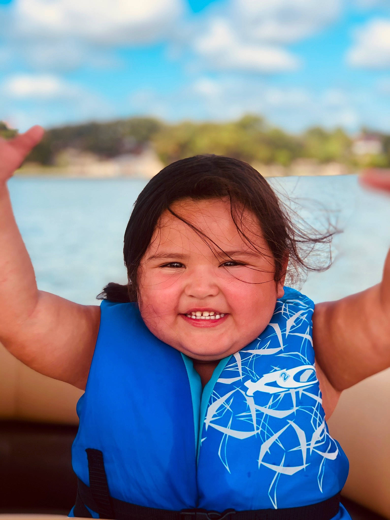 Mackenzie is registered to the contest to win money with this photo: arm, azure, blue, face, finger, flash_photography, fun, gesture, hand, happy, lake, leisure, muscle, neck, people_in_nature, person, shoulder, sky, smile, travel