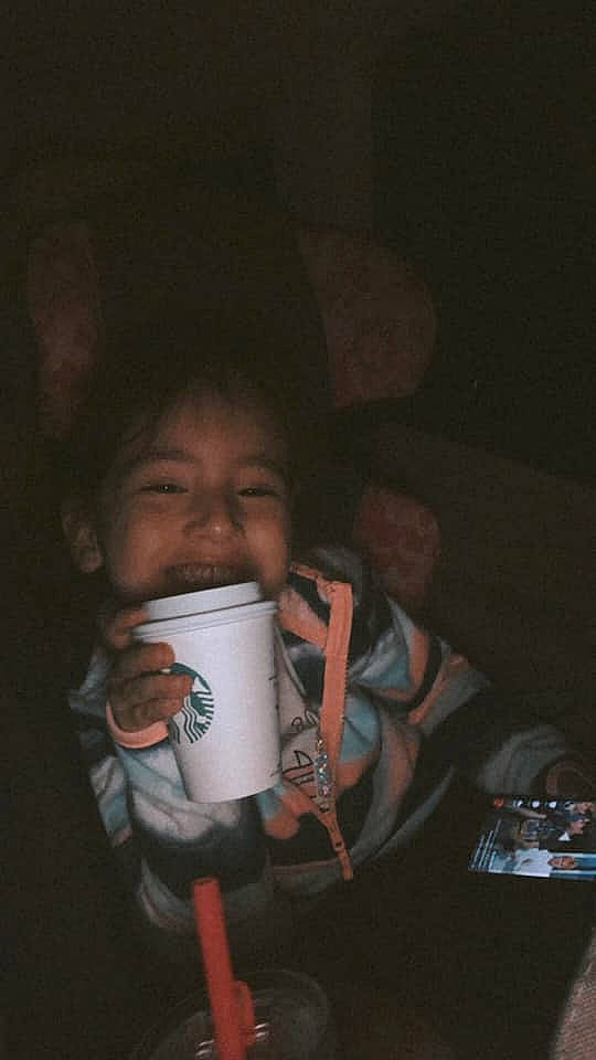 Riley joined the competition — help win amazing prizes! baby, cheek, cup, darkness, drink, drinking, drinkware, eyewear, finger, flash_photography, fun, happy, iris, lip, nail, nose, person, smile, t_shirt, tableware