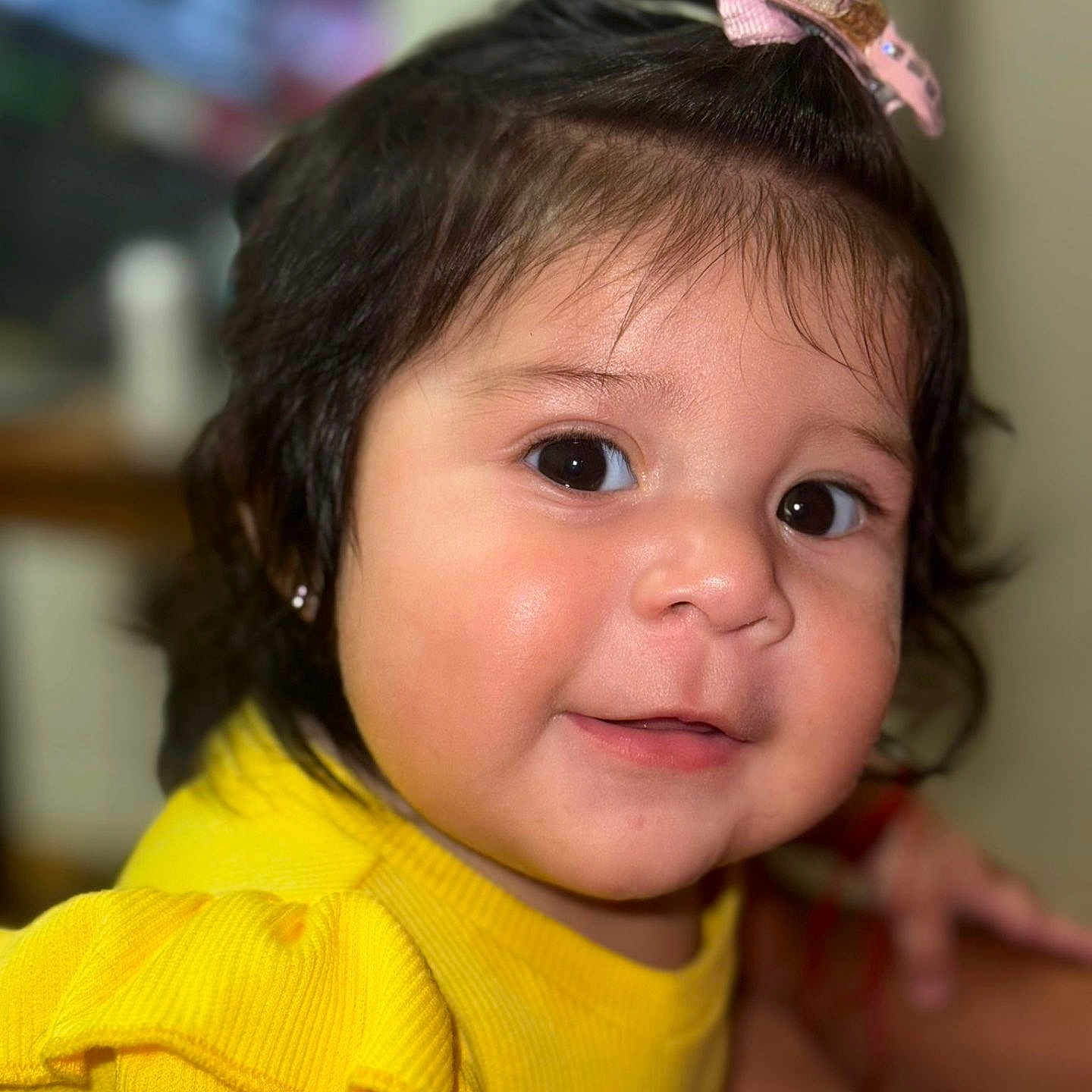 Roxana Rodriguez joined the competition — help win amazing prizes! apparel, baby, bow, child, closeup, cute, eyes, face, fashion, hair, happy, head, indoors, infant, person, portrait, skin, smile, yellow_clothing, young_child