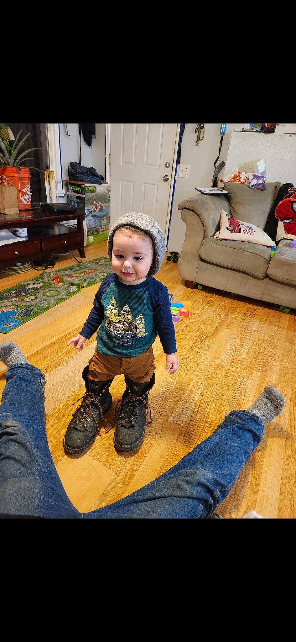 Landen joined the competition — help win amazing prizes! baby, baby_toddler_clothing, child, comfort, floor, flooring, fun, hardwood, laminate_flooring, living_room, mammal, person, product, shoe, sitting, sleeve, smile, sneakers, t_shirt, toddler