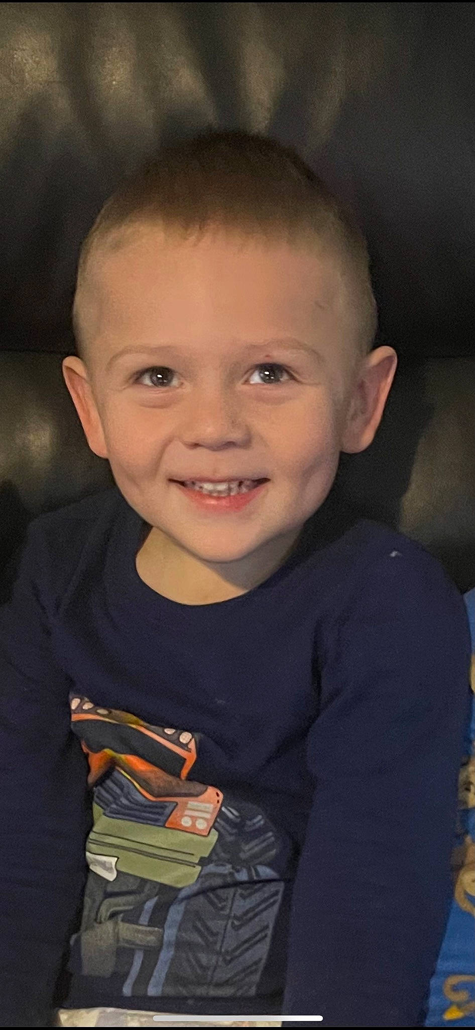 Brenton is registered to the contest to win money with this photo: baby_toddler_clothing, buzz_cut, cheek, child, ear, electric_blue, eye, flash_photography, forehead, fun, happy, iris, joy, lip, nose, person, sitting, skin, sleeve, smile