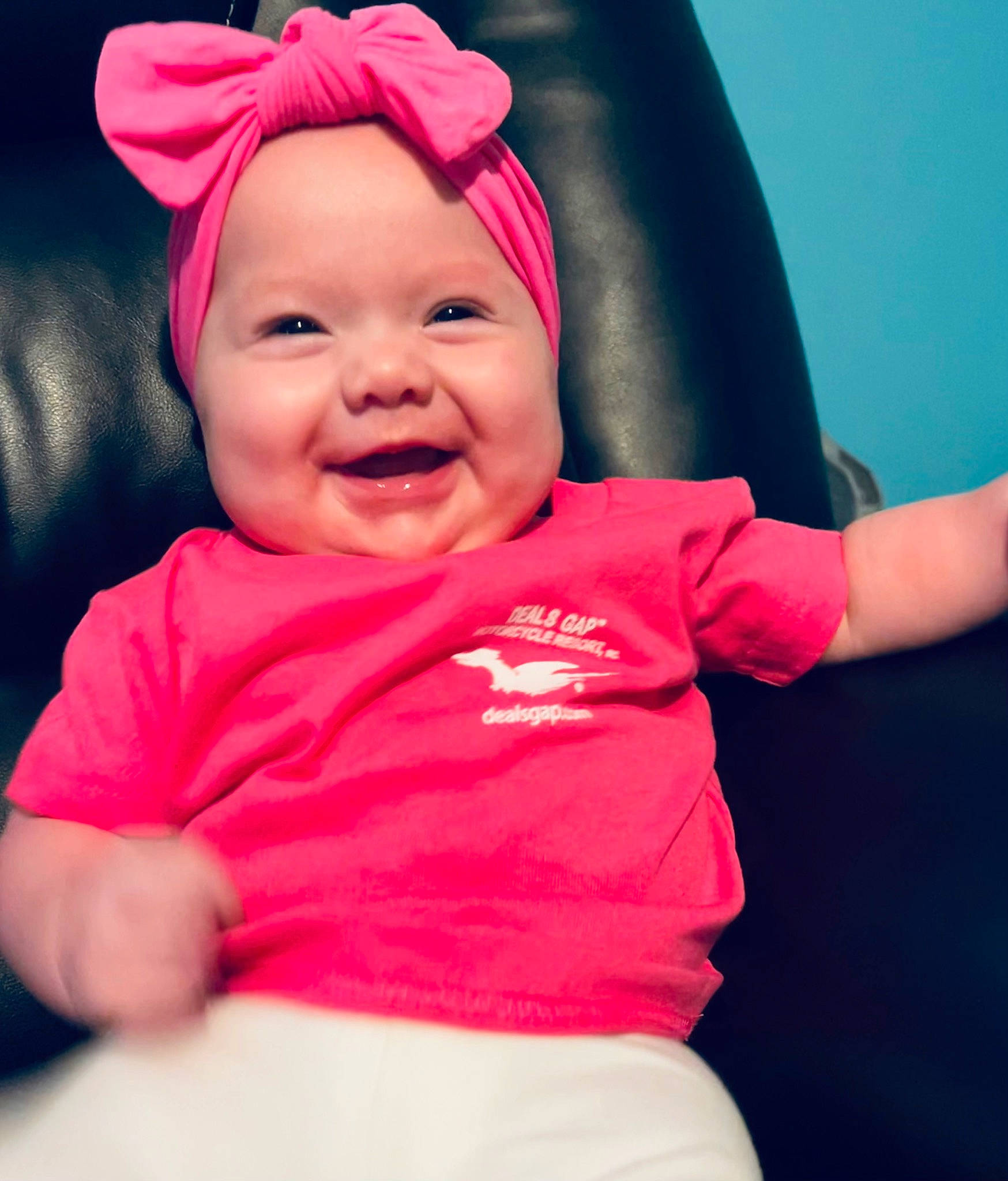 Ayla is registered to the contest to win money with this photo: arm, baby, baby_laughing, baby_toddler_clothing, cap, cheek, chin, comfort, eye, facial_expression, gesture, happy, head, headwear, human_body, joy, lip, mouth, person, pink