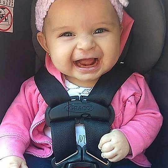 Beatrice is registered to the contest to win money with this photo: baby, baby_carriage, baby_in_car_seat, baby_products, baby_toddler_clothing, car_seat, cheek, child, hair_accessory, happy, headgear, joy, person, pink, product, skin, smile, toddler