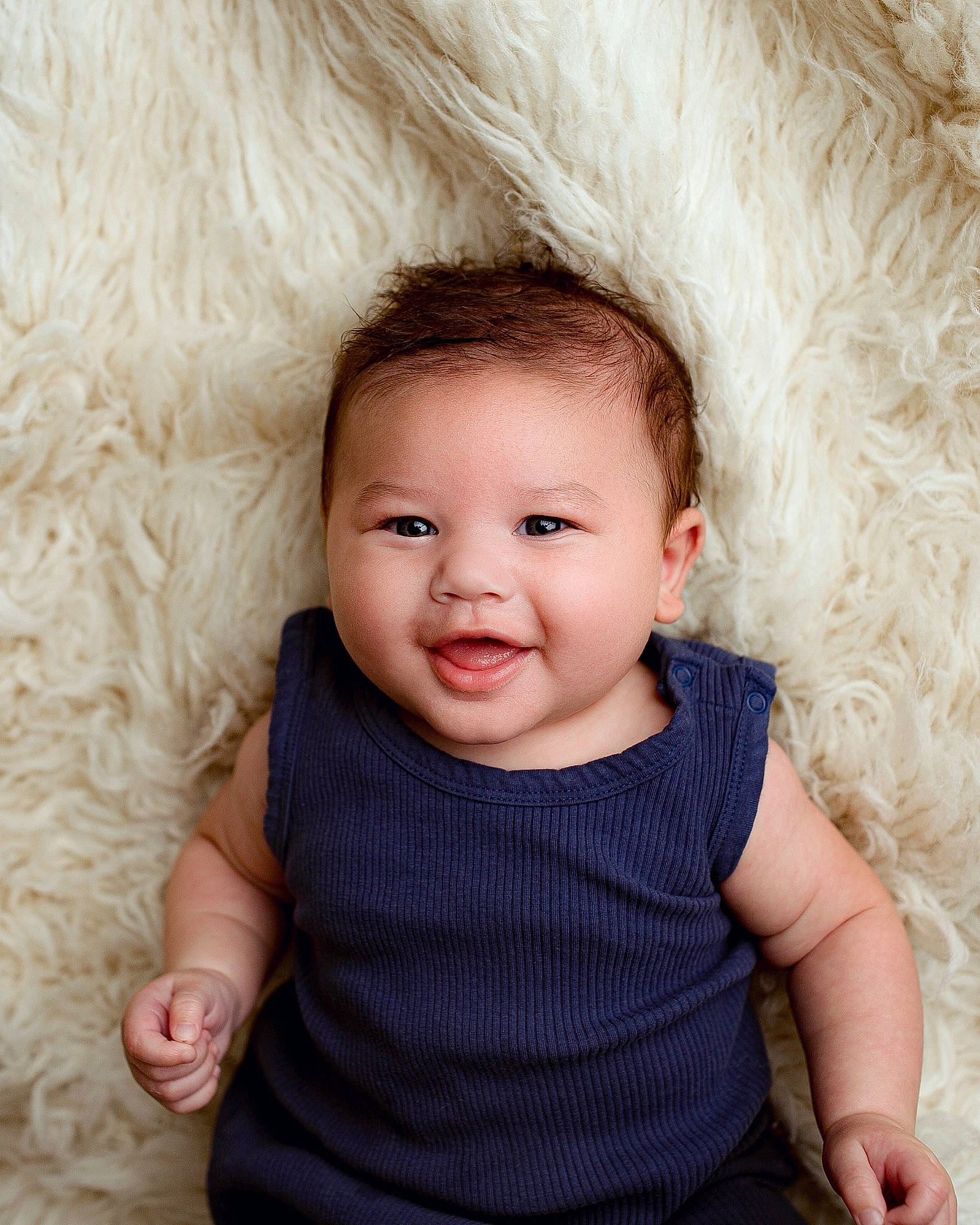 Legend is registered to the contest to win money with this photo: baby, baby_toddler_clothing, cheek, child, close_up, comfort, eye, eyelash, flash_photography, fur, fur_clothing, happy, iris, joy, lip, nose, person, skin, sleeve, smile