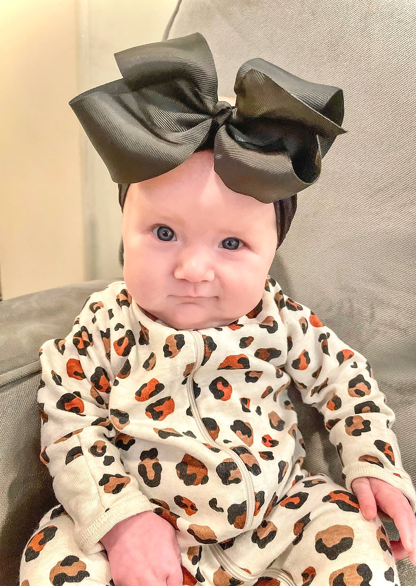 Karsyn is registered to the contest to win money with this photo: baby, baby_toddler_clothing, cap, child, collar, comfort, costume, costume_accessory, costume_hat, eyelash, fashion_accessory, fun, fur, happy, hat, headwear, pattern, person, sitting, sleeve