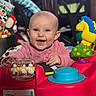 Kodi Sue is registered to the contest to win money with this photo: baby, child, smiling, pink_clothing, activity_center, toy, indoor, happy, face, head, play, colorful, person, infant, cute, bright, furniture, plastic, blue, yellow