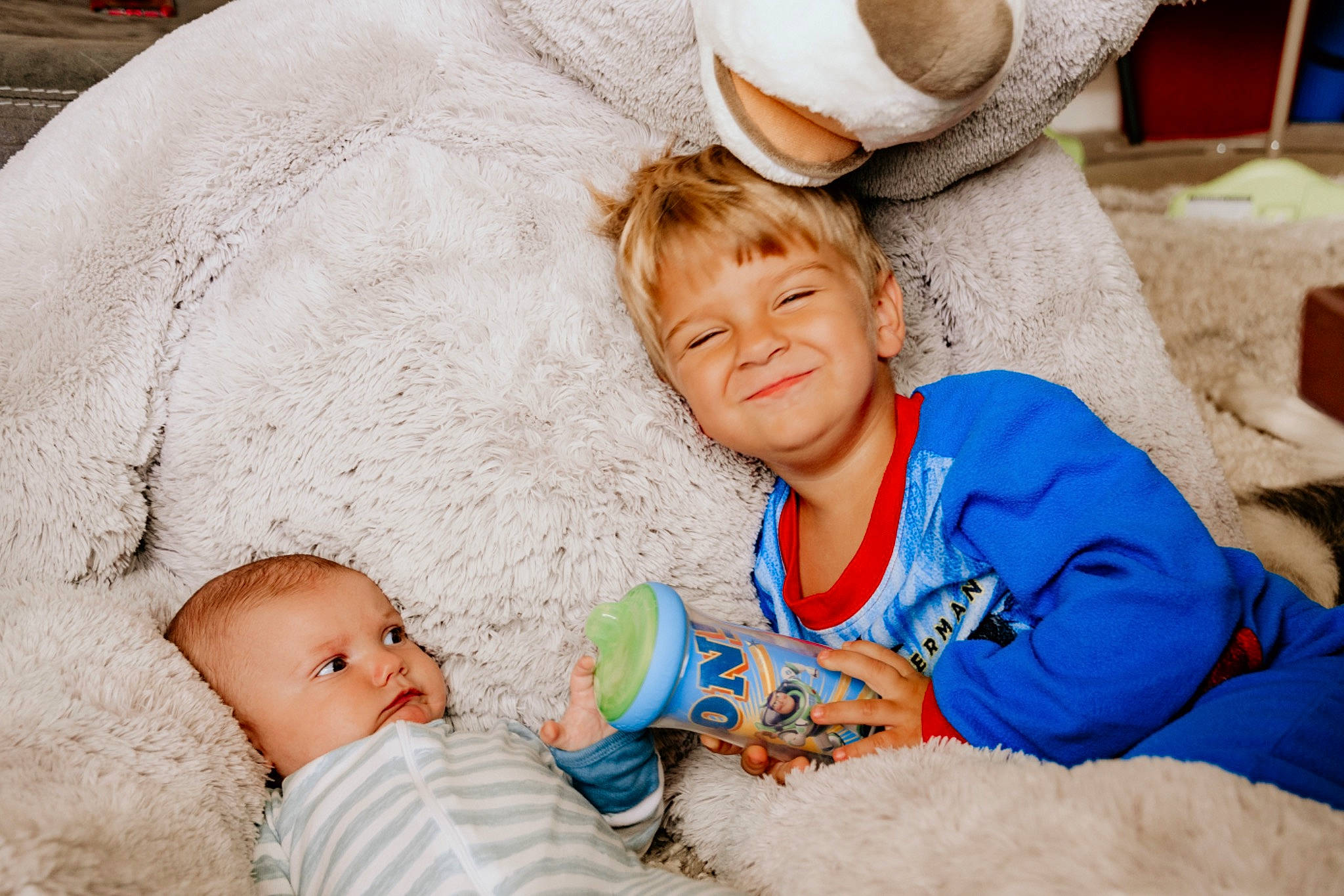 Calihan is registered to the contest to win money with this photo: baby, child, comfort, joy, people, person, sibling, smile, toddler