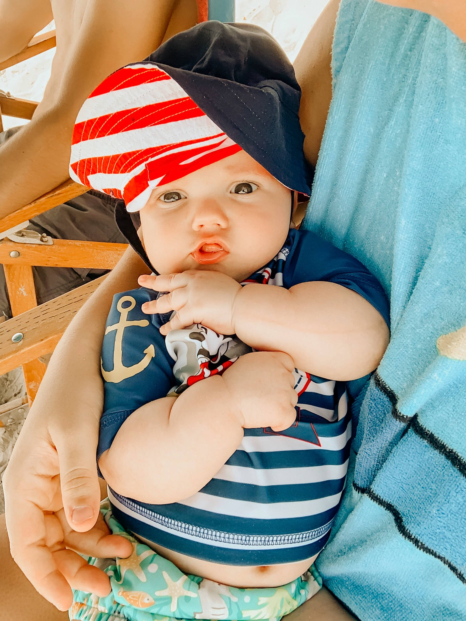 Calihan is registered to the contest to win money with this photo: baby, baby_products, baby_toddler_clothing, beanie, beauty, cap, cheek, child, hand, hat, headgear, headwear, person, product, skin, sun_hat, toddler