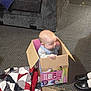 baby, ball, box, cardboard, carton, clothing, couch, face, football, footwear, furniture, head, person, photography, portrait, shoe, sleeping, soccer, soccerball, sport