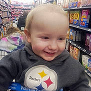 Duwane joined the competition — help win amazing prizes! toddler, child, smile, shopping_cart, grocery_store, cereal_aisle, hoodie, sweatshirt, steelers_logo, walmart_strap, blond_hair, closeup, candid, happy, aisle_shelves, retail, shopping, family_shopping, baby_face, indoor_lighting