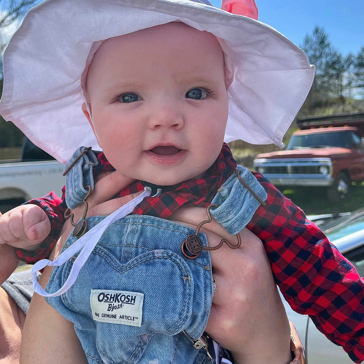 Aubrey joined the competition — help win amazing prizes! baby, bodypart, bonnet, cap, car, clothing, coat, face, finger, hand, hat, head, jeans, pants, person, photography, portrait, sunhat, transportation, vehicle