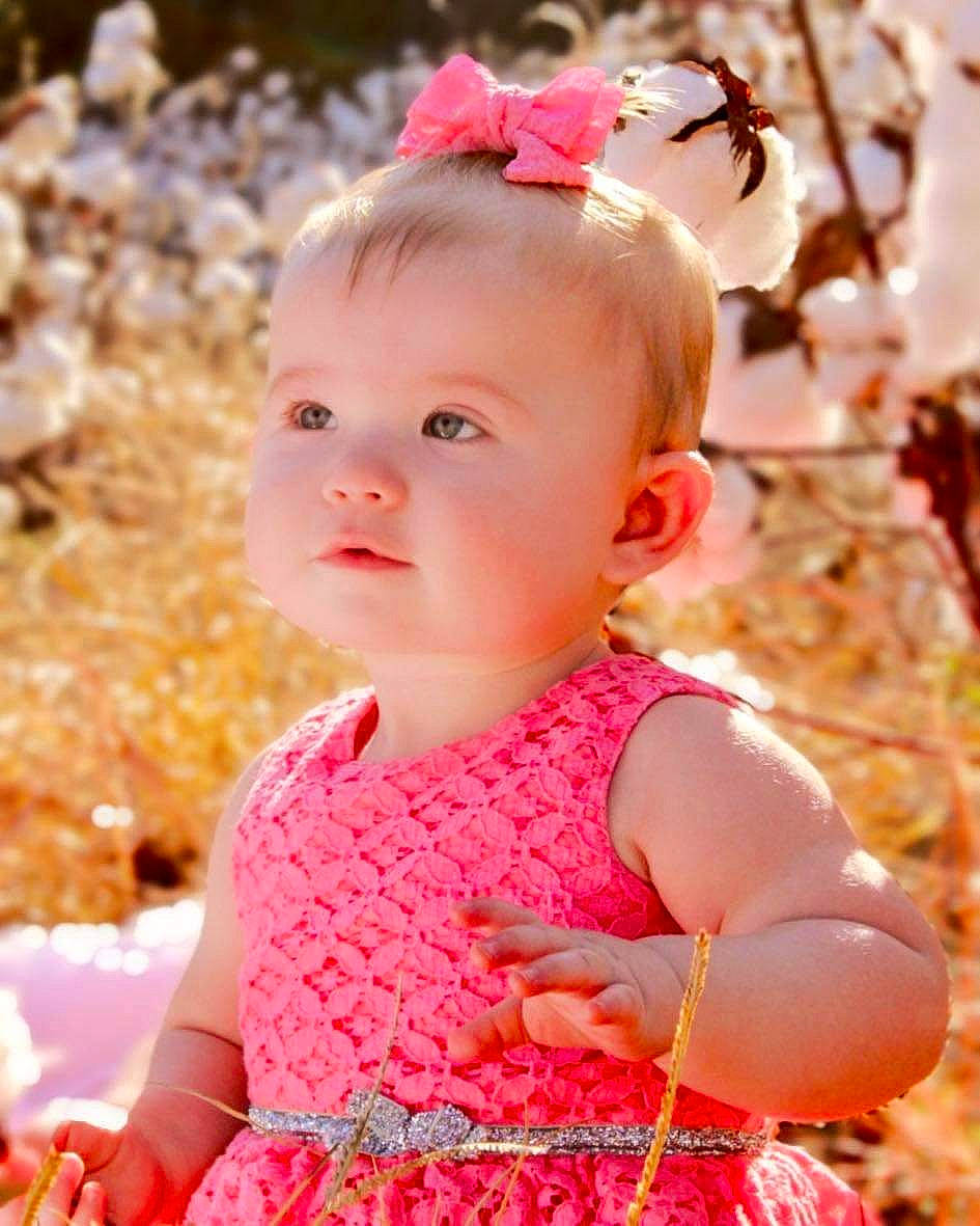 Carly is registered to the contest to win money with this photo: baby, baby_toddler_clothing, beauty, child, dress, embellishment, fun, grass, happy, iris, lip, magenta, pattern, people_in_nature, person, photograph, pink, red, skin, sleeve