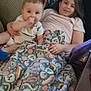 Cairo joined the competition — help win amazing prizes! baby, child, blanket, couch, tablet, smile, indoor, furniture, pattern, textile, person, home, cozy, relaxing, sitting, family, comfort, happy, kids, casual