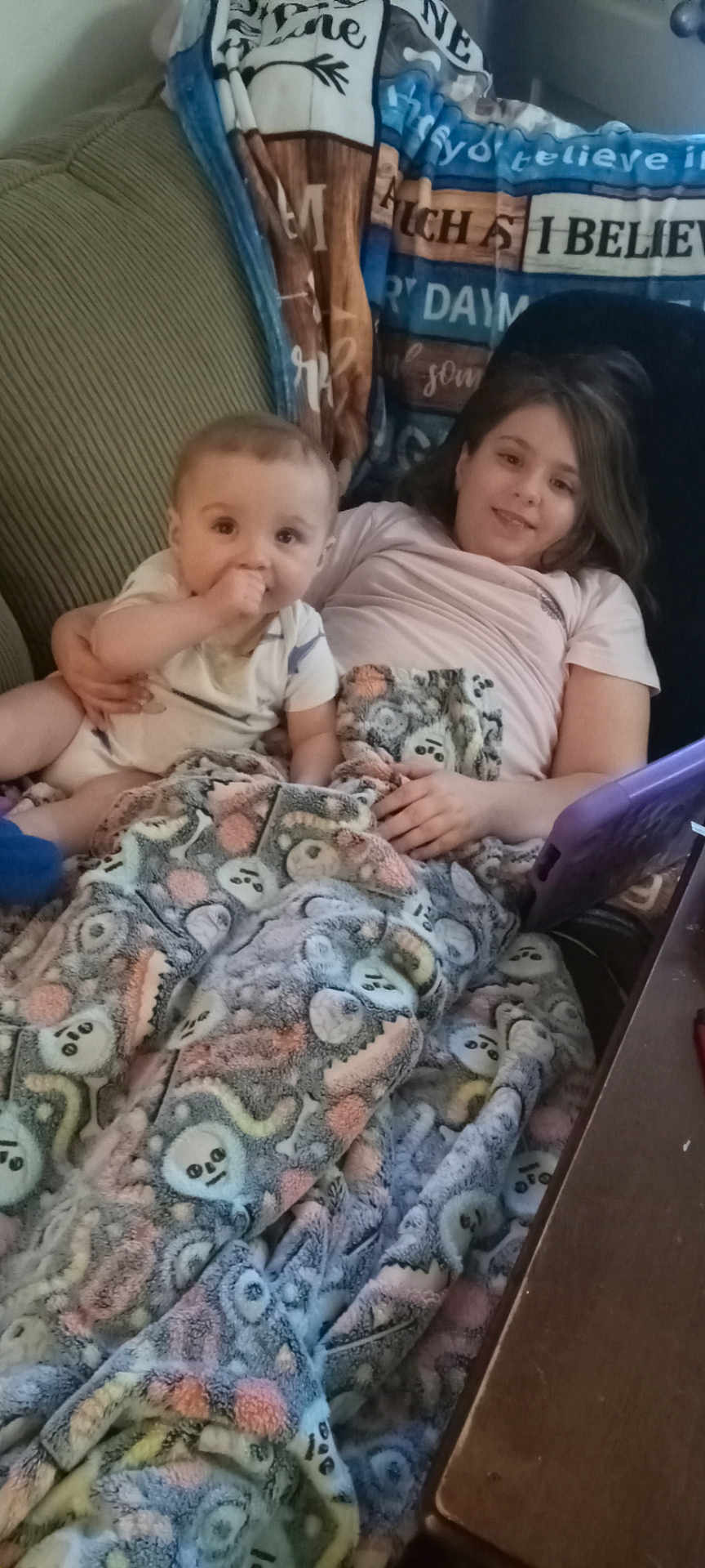 Cairo joined the competition — help win amazing prizes! baby, child, blanket, couch, tablet, smile, indoor, furniture, pattern, textile, person, home, cozy, relaxing, sitting, family, comfort, happy, kids, casual