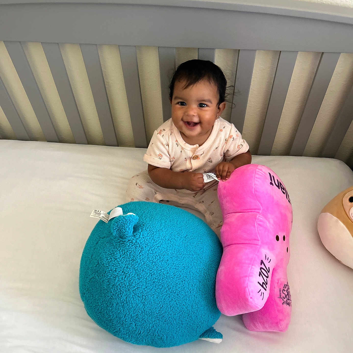 Leilani joined the competition — help win amazing prizes! baby, clothing, crib, cushion, face, furniture, head, homedecor, indoors, infantbed, person, photography, pillow, plush, portrait, sitting, sleeve, toy