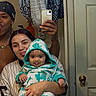 baby, bandana, bathroom, casual, door, door_knob, family, happy, hooded_baby, indoor, man, mirror, phone, playful, portrait, reflection, selfie, striped_shirt, tongue_out, woman